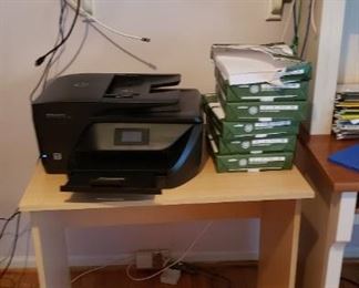 Printer; paper; table; shelf