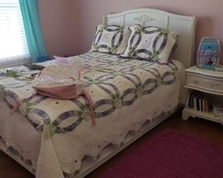 Girl's double bed with headboard and footboard; one drawer night table with storage below