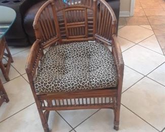 One of the vintage Chinese Bamboo 
Chairs with leopard print cushion
