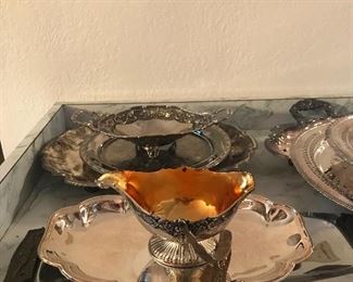 Assorted silver and silver plated serving pieces
