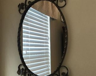 Elegant Oval Mirror with black trim and floral filigree 