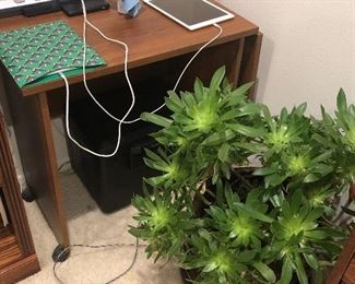 Wood side table on wheels. Can be made bigger with the addition of raising one side.