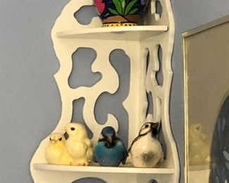 Hanging wall shelf, bird ornaments, and vase