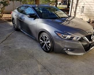 This is a 2018 Maxima SV with 59,000 miles. The ask is $22,35