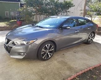 This is a 2018 Maxima SV with 59,000 miles. The ask is $22,350