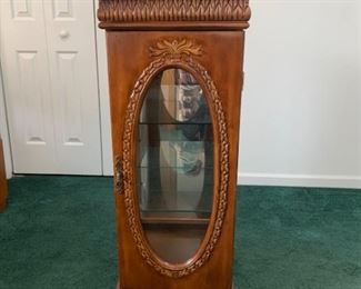 This vintage wooden cabinet features a hinged glass door in front and glass inserts on all sides and a mirror in the back panel. It is finished with beautiful flourishes and has minor scuffs and a slight crack in the bottom left corner of the back mirror panel 17x17x42” Shelves: 12x14”

https://ctbids.com/#!/description/share/755976