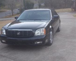 Beautiful Black 2005 Cadillac Deville DTS. Has approx 121K miles. Six photos of exterior ....