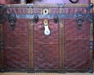 red leather travel trunk