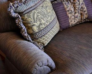 large chair with decorative pillows