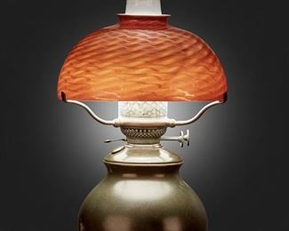 2
A Tiffany Studios Favrile Glass Table Lamp
Circa 1902-1919; New York, NY
Shade signed: L.C.T. / Favrile
The red and gold damascene Favrile glass shade on a single-light patinated bronze converted oil lamp base with glass hurricane chimney, electrified
Overall: 19.5" H x 10" Dia.
Estimate: $2,500 - $3,500