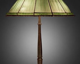 40
A Tiffany Studios "Linenfold" Table Lamp
Circa 1902-1919; New York, NY
Shade signed: Tiffany Studios / New York / 1927 / Pat. Applied For; Base signed: Tiffany Studios / New York / 631
The green "Linenfold," also called "Favrilefabrique," glass shade on a three-light patinated bronze octagonal base with tapered stem, electrified
Overall: 24.5" H x 19.5" Dia.
Estimate: $6,000 - $8,000