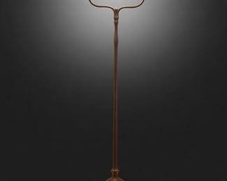 53
A Tiffany Studios Harp Floor Lamp
Circa 1902-1919; New York, NY
Shade signed: L.C.T. / Favrile; Base signed: Tiffany Studios / New York / 423
The gold iridescent damascene Favrile glass shade on a single-light patinated bronze harp tripod base with plain stem raised on tree curved legs with spade feet, electrified
Overall: 55.25" H x 14" Dia.; Shade: 8" Dia.
Estimate: $3,000 - $5,000