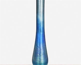 58
A Blue L.C. Tiffany Favrile Glass Bud Vase
Circa 1892-1893; New York, NY
Signed: L.C. Tiffany / Favrile / X 169
The blue iridescent Favrile glass bud vase with tapered body and flared rim raised on a slightly domed foot
12" H x 3.5" Dia.
Estimate: $700 - $900