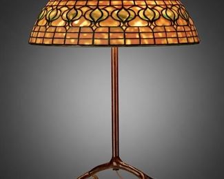 62
A Tiffany Studios "Pomegranate" Table Lamp
Circa 1902-1919; New York, NY
Shade signed: Tiffany Studios / New York / 1457; Base signed: Tiffany Studios / New York
The yellow and green leaded glass "Pomegranate" shade on a three-light patinated bronze four-legged "inverted cradle" base, electrified
Overall: 23.5" H x 16" Dia.
Estimate: $6,000 - $8,000