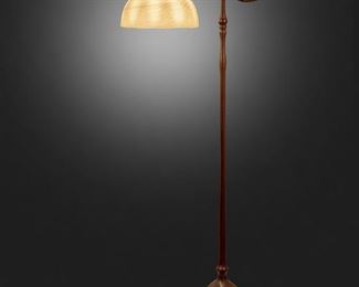 65
A Tiffany Studios Counter-Balance Floor Lamp
Circa 1902-1919; New York, NY
Shade appears unsigned; Base stamped: Tiffany Studios / New York / 468
The yellow iridescent "Wave" Favrile glass shade on a single-light patinated bronze counter-balance base with plain narrow stem, weighted ball in a foliate cradle, foliate socket cover, and adjustable head raised on five curved legs with spade feet, electrified
Overall: 56" H x 16" Dia.; Shade: 10" Dia.
Estimate: $2,000 - $3,000