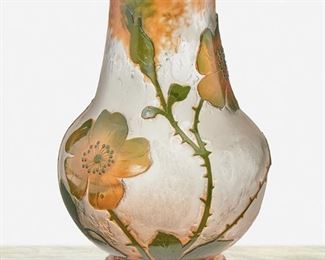 77
A Daum Cameo Glass "Wild Rose" Vase
Late 19th/early 20th Century; Nancy, France
Signed: Daum Nancy [Croix de Lorraine]
The acid-etched cameo glass "Wild Rose" footed vase with tapered neck and bulbous body cut from orange and green to clear
6.75" H x 4.5" Dia.
Estimate: $400 - $600