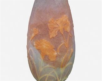 78
A Daum Vitrified Cameo Glass "Carnation" Vase
Late 19th/early 20th Century; Nancy, France
Signed: Daum Nancy [Croix de Lorraine]
The vitrified and acid-etched cameo glass "Carnation" vase with tapered body cut from green and blue to purple and orange, raised on a green foot
11" H x 4.75" Dia.
Estimate: $800 - $1,200