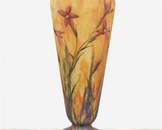 81
A French Mado Nancy Vase
Circa 1920s; Nancy, France
Signed: Mado Nancy
Possibly designed by Paul Daum, the footed vase with tapered body and flared rim decorated with enameled floral motifs over mottled orange and blue glass
11.25" H x 4" Dia.
Estimate: $500 - $700
