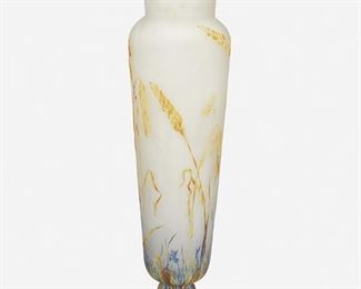83
A Tall Daum Vitrified Cameo Glass Vase
First-quarter 20th Century; Nancy, France
Signed: Daum Nancy [Croix de Lorraine]
The vitrified and acid-etched cameo glass footed vase with tapered body and flared neck cut from orange and blue to clear frost with wheat sheaf and insect motifs
16.75" H x 4.5" Dia.
Estimate: $1,000 - $1,500