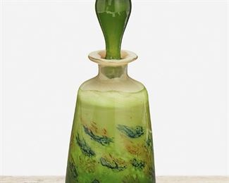 98
A Gallé Paperweight Glass Flacon Perfume Bottle
Late 19th/early 20th Century
Etched signature: Galle
The tapered perfume bottle in green cased paperweight glass with mottled ground surmounted by an elongated stopper
7.75" H x 3" Dia.
Estimate: $600 - $800