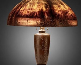 108
A Handel Painted Glass Landscape Table Lamp
Circa 1914; Meriden, Connecticut
Shade signed: Handel / Pat'd. No. 979664 / Handel / 6209 / J.P. [Joseph Palme]; Base signed: Handel
The domical, chipped ice and sand-finished glass shade with obverse and reverse-painted wooded lakeside landscape at sunset in tones of brown, green, and orange on a three-light patinated metal base in the form of a Japanese vase molded with low relief birds and prunus blossoms raised on a stepped Chinese pierced hardwood-style foot, electrified
Overall: 22" H x 18" Dia.
Estimate: $2,000 - $3,000