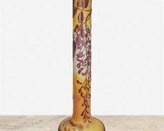 115
A Tall Gallé Cameo Glass "Wisteria" Vase
Circa 1910; Nancy, France
Signed: Galle
The acid-etched cameo glass "Wisteria" vase with cylindrical neck and wide base cut from purple to yellow frost
30" H x 9.5" Dia.
Estimate: $2,000 - $3,000