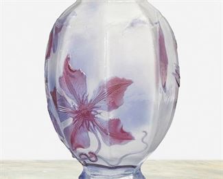 124
A Gallé Cameo Glass "Clematis" Vase
Late 19th/early 20th Century; Nancy, France
Signed: Galle
The acid-etched cameo glass hexagonal "Clematis" vase with footed base cut from red and lavender to clear
7" H x 4.5" Dia.
Estimate: $600 - $800