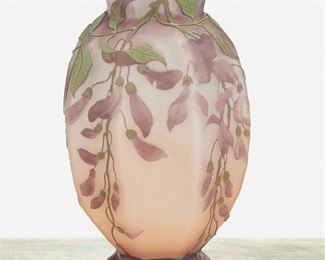 127
A Gallé Cameo Glass "Wisteria" Vase
Late 19th/early 20th Century; Nancy, France
Signed: Galle
The acid-etched cameo glass hexagonal "Wisteria" vase with footed base cut from lavender to clear and peach frost with green enamel leaves
7" H x 4.5" W
Estimate: $1,000 - $1,500