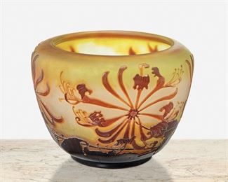 129
A Gallé Cameo Glass "Honeysuckle" Vase
Late 19th/early 20th Century; Nancy, France
Signed: Galle
The acid-etched cameo glass wide-shouldered "Honeysuckle" vase cut from amber to pale green and white frost
5.25" H x 8" Dia.
Estimate: $800 - $1,200
