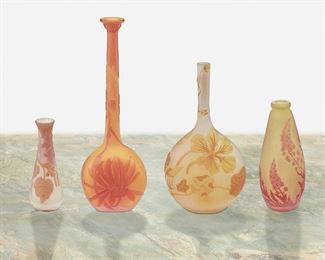 159
Four Gallé And Muller Frères Cameo Glass Bud Vases
Late 19th/early 20th Century; France
Two signed: Galle; One signed: Galle [starred]; One signed: Muller
Each acid-etched cameo glass, comprising one tall-necked "Chrysanthemum" vase with flared rim cut from orange to orange frost, one tall-necked "Nasturtium" vase cut from yellow to white frost, one tapered "Delphinium" vase cut from red to chartreuse frost, and one flared vase with floral motif cut from chartreuse and red to white frost, 4 pieces
Largest: 8" H x 2.625" W x 1.625" D; Smallest: 3.75" H x 1.375" Dia.
Estimate: $800 - $1,200