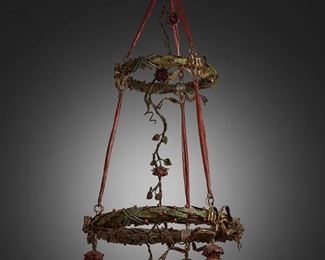 181
A Two-Tier Painted Metal Chandelier
First-quarter 20th Century
The two-tiered, four-light painted metal chandelier with two wreath-style circular frames decorated with red berries and gilt bows surrounding a central descending rose vine tendril, fitted with four rose-style drop pendant lights terminating in pink oil speckled Bohemian glass shades with spun green overlay, electrified
56" H x 26" Dia.
Estimate: $1,500 - $2,000