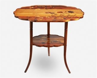 182
A Gallé Two-Tiered Marquetry Table
Circa 1885-1904; Nancy, France
Inscribed signature: Emile Galle / Nancy / EG / [Croix de Lorraine]
The two-tiered table with shaped top over a narrowing undershelf, each with marquetry flowers, raised overall on four straight legs with flared feet, the upper tier with fitted glass top
29" H x 34.5" W x 24.5" D
Estimate: $1,500 - $2,000