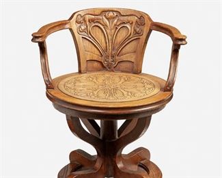 191
An Art Nouveau-Style Swivel Arm Chair
First-quarter 20th Century or later
Leather signed: P. Mykytka / 12.19.89
The oak swivel arm chair with figural carved back splat and inset tooled leather seat with floral motif supported by four curved legs
28" H x 24.5" W x 23" D
Estimate: $600 - $800