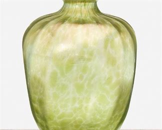 204
A Loetz Crete Papillon Vase
Late 19th/early 20th Century
Signed: Loetz / Austria
The four-sided vase with flared rim and descending ribbed details in iridescent green Crete Papillon glass
8.75" H x 6" Dia.
Estimate: $300 - $500