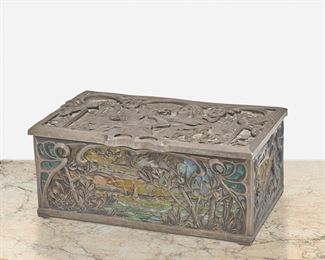 208
An Art Nouveau Pewter And Glass Vanity Box
Late 19th/early 20th Century
The rectangular, hinged lid pewter box with polychrome glass mosaic panels depicting seaside and wooded landscapes and a figural scene with a gilt interior
2.5" H x 6" W x 3.5" D
Estimate: $800 - $1,200