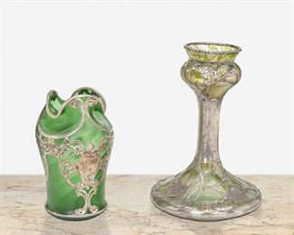 210
Two Art Nouveau Loetz-Style Sterling Silver Overlay Glass Vases
Late 19th/early 20th Century
One marked: 999/1000; One marked for La Pierre; Further marked: Sterling
Comprising an iridescent green vase with leaf motif overlay and an emerald green vase with satin finish with foliate and flower motif overlay, 2 pieces
Larger: 9" H x 6" Dia.; Smaller: 6.75" H x 4" Dia.
36.230 gross oz. troy approximately
Estimate: $600 - $800