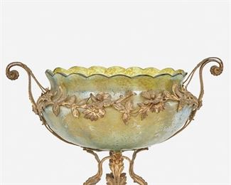211
A Loetz-Style Gilt-Metal Mounted Glass Centerpiece
Late 19th/early 20th Century
The oval basin in iridescent green glass with amber oil spot finish and flared scalloped edge raised on a gilt-metal footed base and mounted with two scrolling handles and floral border
13" H x 17" W x 10" D
Estimate: $600 - $800