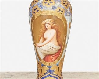 212
An Art Nouveau Royal Vienna "Solitude" Portrait Vase
Late 19th/early 20th Century
Marked with blue underglaze Bindenschild; Further marked: Solitude / Dec. 341 / Depose; Signed: Wagner
The baluster-form vase with central cartouche after Angelo Asti's "Solitude" (1847–1903, French) enclosed by gilt-highlight floral motifs against a green and blue mottled ground
11.5" H x 4.5" Dia.
Estimate: $1,500 - $2,000