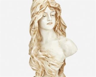 215
An Amphora "Reflexion" Ceramic Bust
Late 19th/early 20th Century
Marked: Amphora / 1243 / 21
The ceramic bust depicting a woman with flowing hair atop a squared plinth inscribed "Reflexion"
20" H x 10.5" W x 8" D
Estimate: $500 - $700