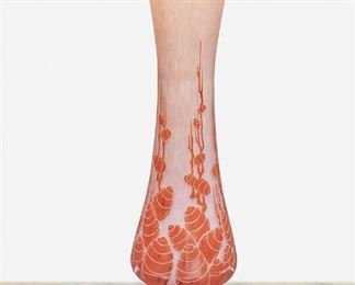 232
A Charles Schneider Le Verre Français Glass Vase
Circa 1918-1932; Paris, France
Signed: Charder / Le Verre Francais
The acid-etched cameo glass vase with flared body and footed base cut from mottled orange to pink frost with cedar buds motif and geometric border
27.75" H x 8" Dia.
Estimate: $2,000 - $3,000