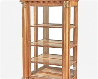 242
A Biedermeier-Style Vitrine Cabinet
First-half 19th Century
The Biedermeier-style vitrine with foliate marquetry, scrolled pediment, and giltwood egg-and-dart molding over molded dentil and Corinthian columns with giltwood capitals flanking the cabinet body with locked glazed door, plate glass side panels, and fitted interior with three shelves and mirrored back raised overall on four block feet
77.5" H x 43" W x 24" D
Estimate: $1,500 - $2,000