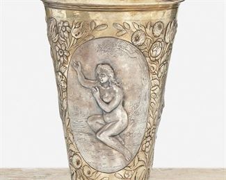 243
A Russian Two-Tone Silver Figural Vase
1797; St. Petersburg, Russia
Marked for St. Petersburg; Further marked: 1797 / CV
The two-toned repousse silver vase with three figural scenes depicting nude female figures in oval cartouches enclosed by gold-toned floral swags
7" H x 5" Dia.
14.12 oz. troy approximately
Estimate: $500 - $700