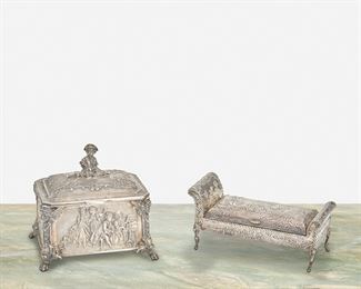 248
A Sterling Silver Box And Inkwell
Second-half 19th Century
Each marked for sterling
Comprising a hinged French-style German Hanau repousse box with courtiers and pastoral scenes surmounted by a figural bust finial and an English-made Dutch silver repousse inkwell in the form of a chez lounge fitted with three interior compartments, 2 pieces
Larger: 5" H x 5" W x 3.75" D; Smaller: 3.75" H x 6" W x 3.625" D
22.755 oz. troy approximately
Estimate: $600 - $800