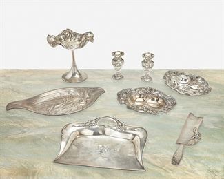 249
Eight American Art Nouveau Sterling Silver Items
Late 19th/early 20th Century
Each marked for sterling; Various makers
Comprising a raised repousse compote with floral motif and ribbon edge, a pair of Foster & Bailey diminutive vases with figural masks and fish motif, a Shreve & Co. dust tray and crumber with iris motif, a Wallace repousse oval tray with floral motif, and a pair of William B. Kerr & Co. repousse bon-bon dishes with floral motif, 8 pieces
Largest: 6.5" H x 6.5" Dia.
35.275 oz. troy approximately
Estimate: $400 - $600