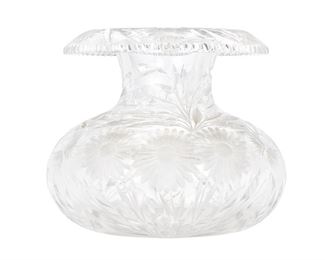 254
An American Brilliant Cut Glass Centerpiece Vase
Late 19th/early 20th Century
The Brilliant cut glass vase with bulbous body, pinched neck, and flared rim with sawtooth edge and floral motif throughout
10" H x 11" Dia.
Estimate: $600 - $800