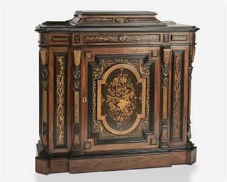 259
An American Renaissance Revival Console Cabinet
Third-quarter 19th Century
The breakfront-style Renaissance Revival console cabinet with ebonized wood accents, incised gilt highlights, geometric parquetry to the sides, and pedestal top over a single frieze drawer with lockplate, a door with floral inlay to front panel and lockplate, and fitted interior with a single shelf
45" H x 49" W x 16.5" D
Estimate: $1,500 - $2,000