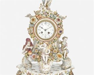 262
A Capodimonte Mantel Clock With Matching Base
First-half 19th Century; Naples, Italy
Each marked with blue underglaze crowned "N"; Movement serial number: 334 24
The porcelain mantel clock designed with applied flowers, floral sprays, and gilt highlights, comprising a footed clock with two-train movement and white enameled dial with black Arabic numeral hour markers, minute track, and floral festoons encircled by a floral garland and four putti, raised on a three-footed stand, 2 pieces
Overall: 22" H x 13.75" W x 8.5" D
Estimate: $1,000 - $1,500