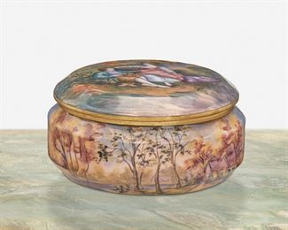 266
A Limoges Enamel Vanity Box
Second-half 19th Century; France
Signed: Gamet / France
The circular enamel-over-metal vanity box with pastoral figural scene depicting a courting couple to the lid and woodland scene to the base
3" H x 6" Dia.
Estimate: $600 - $800