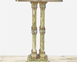 270
A Green Onyx And Champlevé Lamp Table
Late 19th/early 20th Century
The gilt-bronze mounted green onyx lamp table with champleve enamel border and column accents over four columns and raised on a pedestal base with four paw feet
31" H x 18.5" W x 18.5" D
Estimate: $1,000 - $2,000