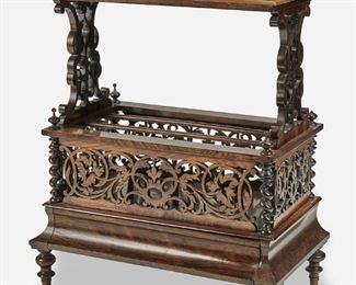 271
An English Rosewood Canterbury
Mid-19th Century
The rosewood Canterbury with openwork gallery rail to the top supported by fretwork sides atop an openwork lower compartment with two interior partitions and serpentine columns over a single lower drawer raised overall on turned feet with castors
29" H x 29" W x 16.5" D
Estimate: $1,000 - $1,500